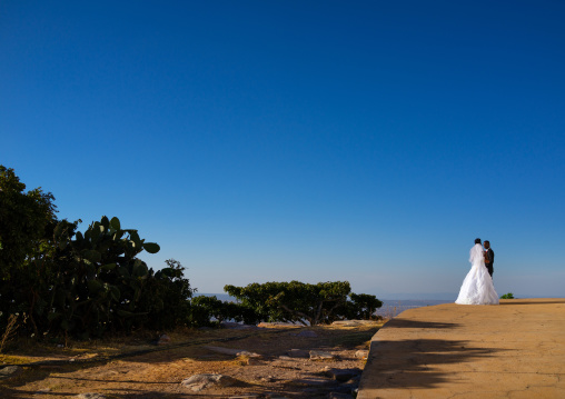 Newly wed couple overlooking the city, Huila Province, Lubango, Angola