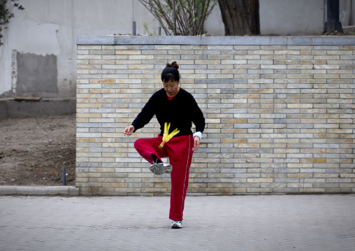 Woman Making Execices In The Street, Beijing China