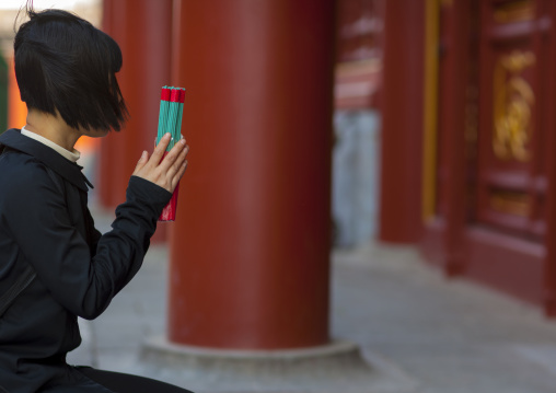 Woman Praying At Lama Temple, Beijing, China