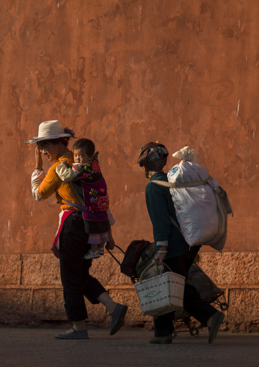 People Passing In Front Of Chaoyang Tower City Gate, Ancient Town, Jianshui, Yunnan Province, China