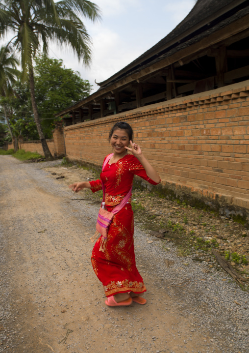 Dai Woman Making V Sign, Galamba, Xishuangbanna Region, Yunnan Province, China