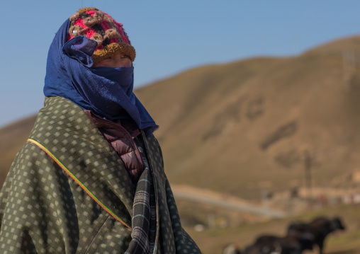 Tibetan nomad in the moutain during winter time, Tongren County, Rebkong, China