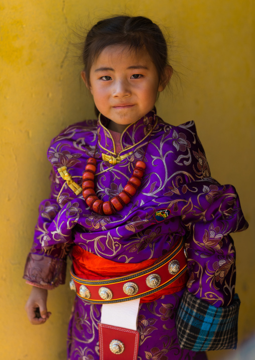 Tibetan child girl with a huge necklace, Tongren County, Rebkong, China