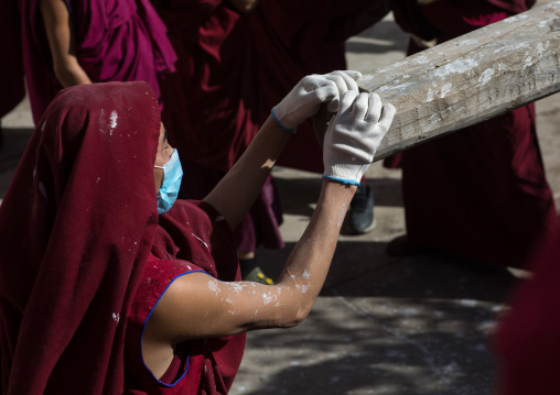 Monks preparing the painting of a temple in Rongwo monastery, Tongren County, Longwu, China