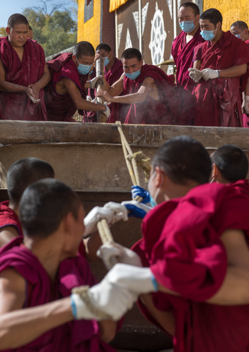 Monks preparing the painting of a temple in Rongwo monastery, Tongren County, Longwu, China