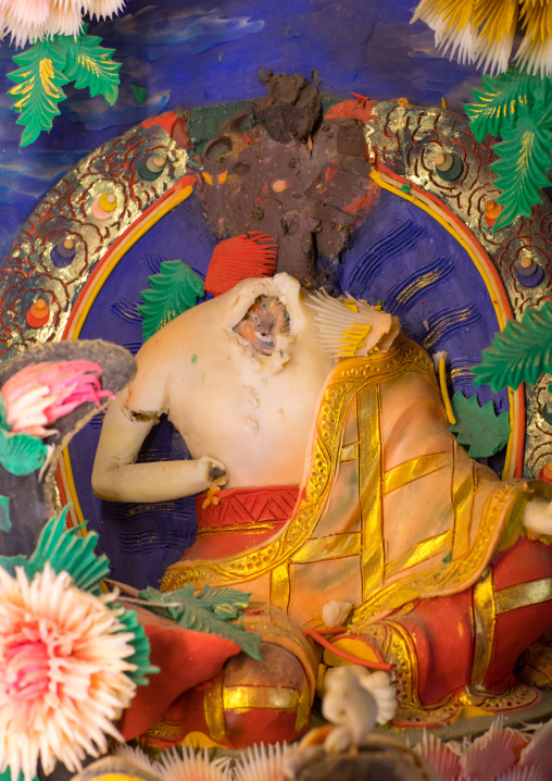 Tibetan buddhist sculpture with head cut made by monks from coloured butter in Labrang monastery, Gansu province, Labrang, China