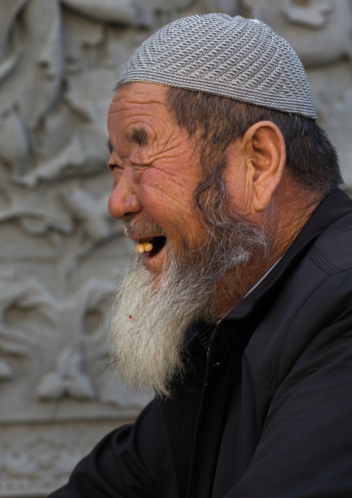 Smiling hui muslim man in the street
, Gansu province, Linxia, China