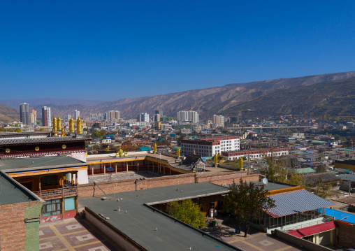 Rongwo monastery in front of the modern town, Tongren County, Longwu, China