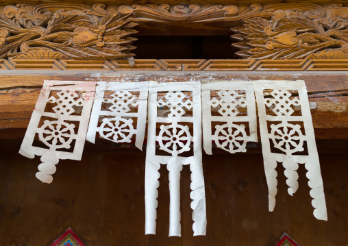 Paper cut hangs on a door to bring luck, Tongren County, Longwu, China