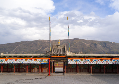 Prayer wheels alley in Rongwo monastery, Tongren County, Longwu, China