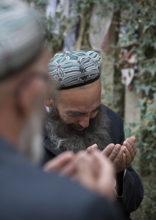 Uyghur Sufi Men Praying At Imam Asim Tomb In The Taklamakan Desert, Xinjiang Uyghur Autonomous Region, China