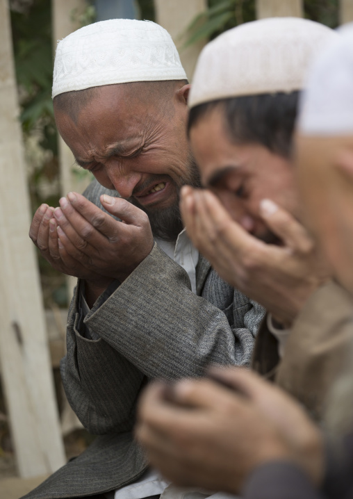 Uyghur Sufi Men Praying At Imam Asim Tomb In The Taklamakan Desert, Xinjiang Uyghur Autonomous Region, China