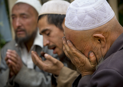 Uyghur Sufi Men Praying At Imam Asim Tomb In The Taklamakan Desert, Xinjiang Uyghur Autonomous Region, China