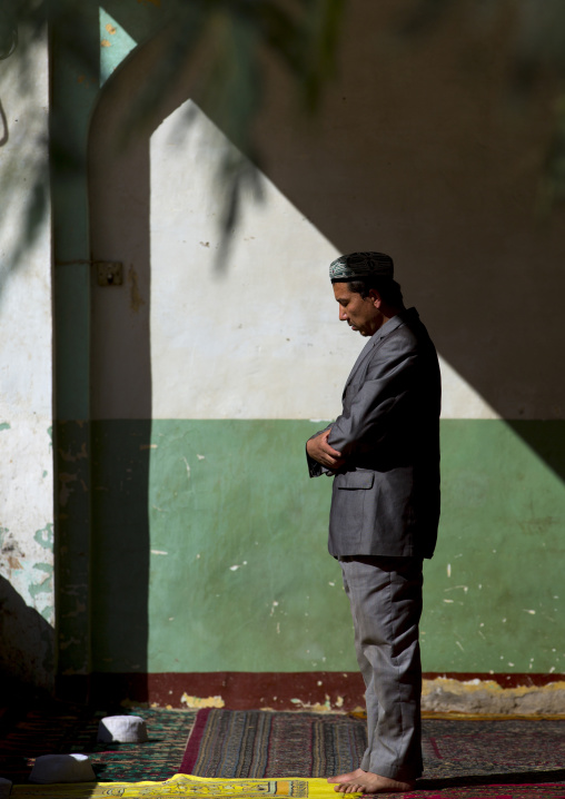 Man Praying Inside Altyn Mosque, Yarkand, Xinjiang Uyghur Autonomous Region, China