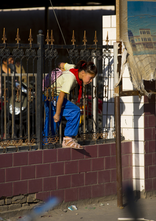 Uyghur Girl Going Out Of School, Yarkand, Xinjiang Uyghur Autonomous Region, China