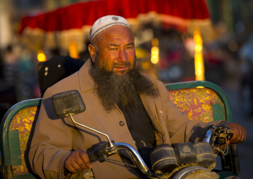 Uyghur Man Driving A Motorized Cart, Yarkand, Xinjiang Uyghur Autonomous Region, China