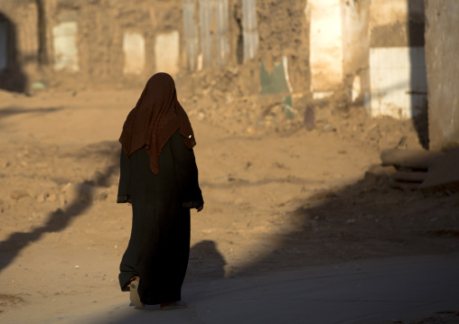 Woman Passing By Demolished Houses, Old Town Of Kashgar, Xinjiang Uyghur Autonomous Region, China