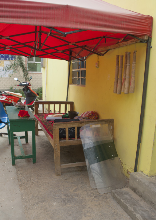 Police Riot Shields And Truncheon Outside A Uyghur School, Keriya, Old Town, Xinjiang Uyghur Autonomous Region, China