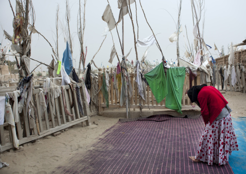 Woman Praying At Imam Asim Tomb In The Taklamakan Desert, Xinjiang Uyghur Autonomous Region, China