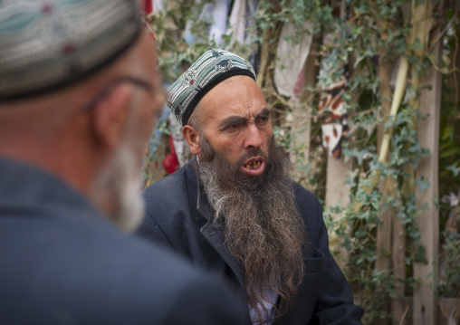 Uyghur Sufi Men Praying At Imam Asim Tomb In The Taklamakan Desert, Xinjiang Uyghur Autonomous Region, China