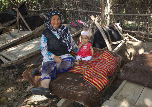 Uyghur Old Woman And Baby On A Cart, Yecheng, Xinjiang Uyghur Autonomous Region, China