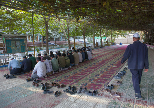 Men Praying Under A Pergola In Mosque, Yarkand, Xinjiang Uyghur Autonomous Region, China