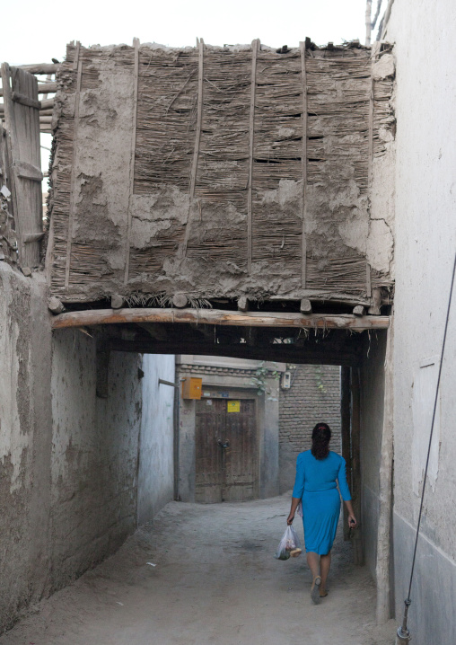 Uyghur Woman Walking In The Street, Yarkand, Xinjiang Uyghur Autonomous Region, China