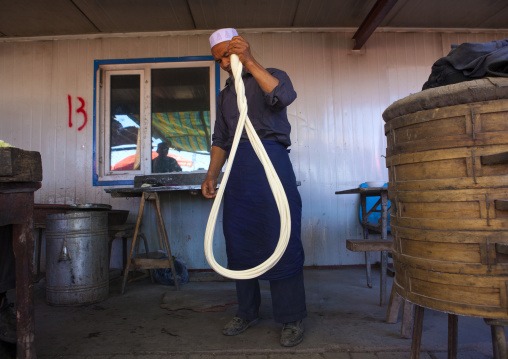 Uyghur Man Making Fresh Laghman Noodles In Kashgar Animal Market, Xinjiang Uyghur Autonomous Region, China