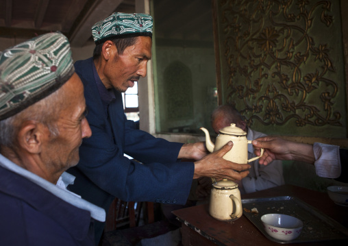 Uyghur Men In Ostangboyi Tea House, Kashgar, Xinjiang Uyghur Autonomous Region, China