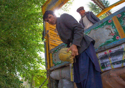 Watermelons carried out of a truck in the market, Badakhshan province, Ishkashim, Afghanistan