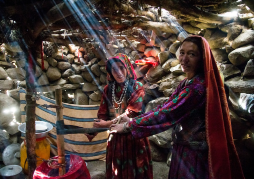 Wakhi nomad women making butter in the pamir mountains, Big pamir, Wakhan, Afghanistan