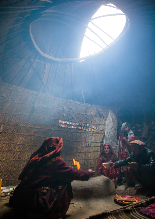 Wakhi nomad family eating breakfast inside their yurt, Big pamir, Wakhan, Afghanistan