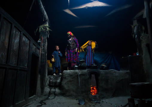 Afghan family inside their traditional pamiri house, Badakhshan province, Khandood, Afghanistan