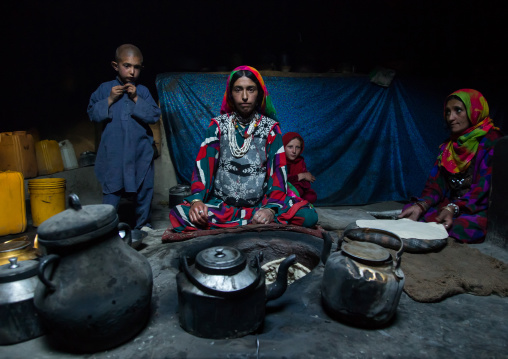 Afghan woman making bread inside her traditional pamiri house, Badakhshan province, Khandood, Afghanistan