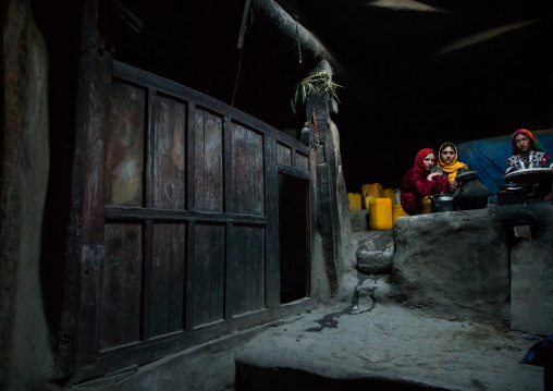 Afghan family inside their traditional pamiri house, Badakhshan province, Khandood, Afghanistan