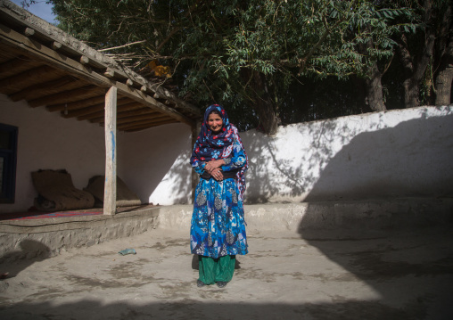 Afghan woman in her traditional pamiri house courtyard, Badakhshan province, Qazi deh, Afghanistan