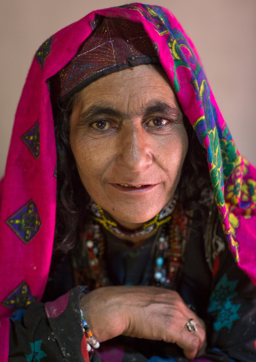 Portrait of an afghan woman in pamiri traditional clothing, Badakhshan province, Wuzed, Afghanistan