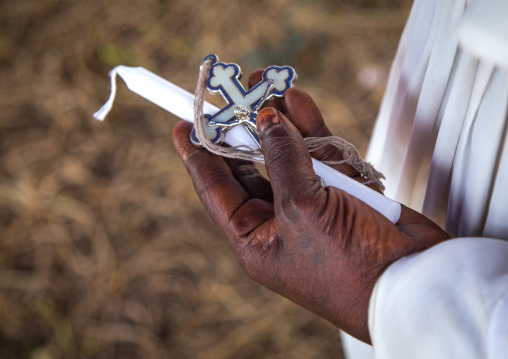 Benin, West Africa, Ganvié, celestial church of christ member with a cross and a candle in his hand