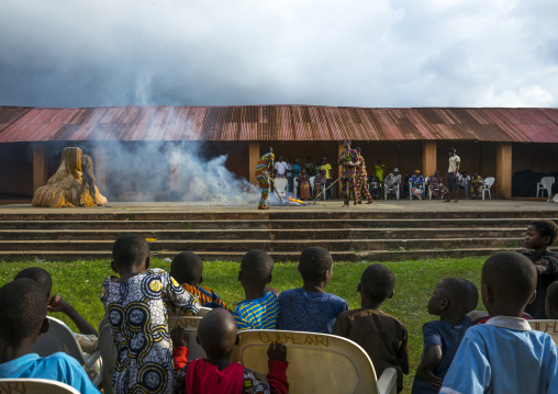 Benin, West Africa, Porto-Novo, men putting fire to a zangbeto guardian of the night in the royal palace