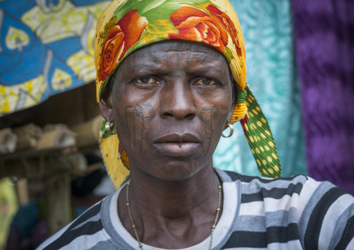 Benin, West Africa, Onigbolo Isaba, holi tribe woman covered with traditional facial tattoos and scars