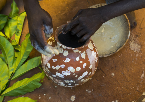 Benin, West Africa, Bonhicon, kagbanon bebe voodoo priest during a ceremony drawing white spots on a pot