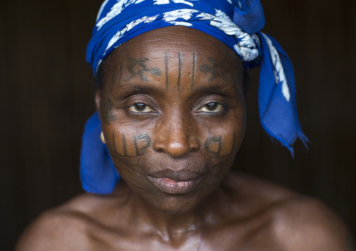 Benin, West Africa, Onigbolo Isaba, holi tribe woman covered with traditional facial tattoos and scars