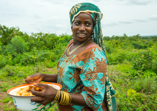 Benin, West Africa, Taneka-Koko, fulani peul tribe woman bringing food for a wedding