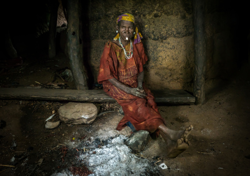 Togo, West Africa, Nadoba, old woman inside a traditional tata somba house