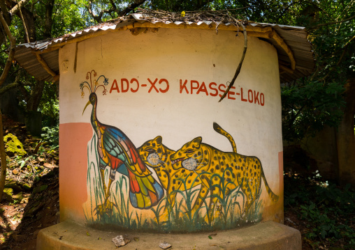 Benin, West Africa, Ouidah, temple in the sacred forest of kpasse painted wall