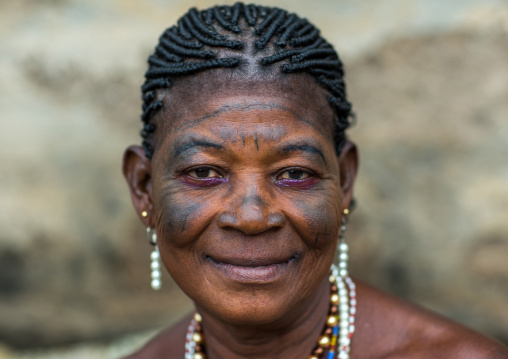 Benin, West Africa, Bopa, voodoo priestess with tattooed face during a ceremony