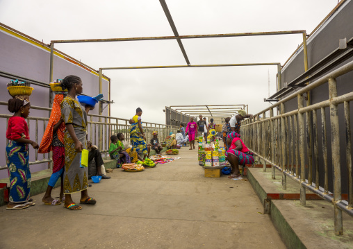 Benin, West Africa, Cotonou, people crossing the bridge over dantokpa market