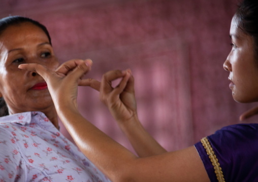 Cambodian dancer with her teacher during a training session of the National ballet, Phnom Penh province, Phnom Penh, Cambodia