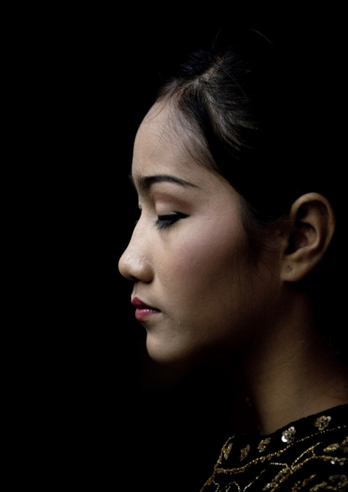 Side view of a cambodian dancer face during a training session of the National ballet, Phnom Penh province, Phnom Penh, Cambodia