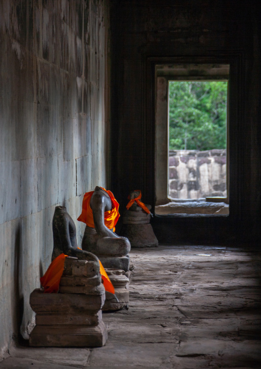 Headless stone buddha statues inside the Angkor wat temple complex, Siem Reap Province, Angkor, Cambodia